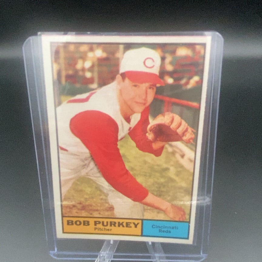 1961 Topps #9 Bob Purkey baseball card: This is a vintage baseball card featuring Bob Purkey of the Cincinnati Reds. The card shows a color photograph of the pitcher in his uniform.
