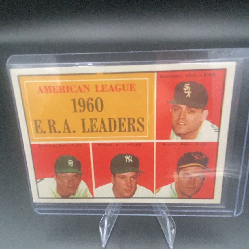 1961 Topps #46 American League E.R.A. Leaders baseball card: This is a 1961 Topps trading card featuring the American League E.R.A. Leaders. The card showcases four baseball players from various teams including the White Sox, Tigers, Yankees, and Orioles.