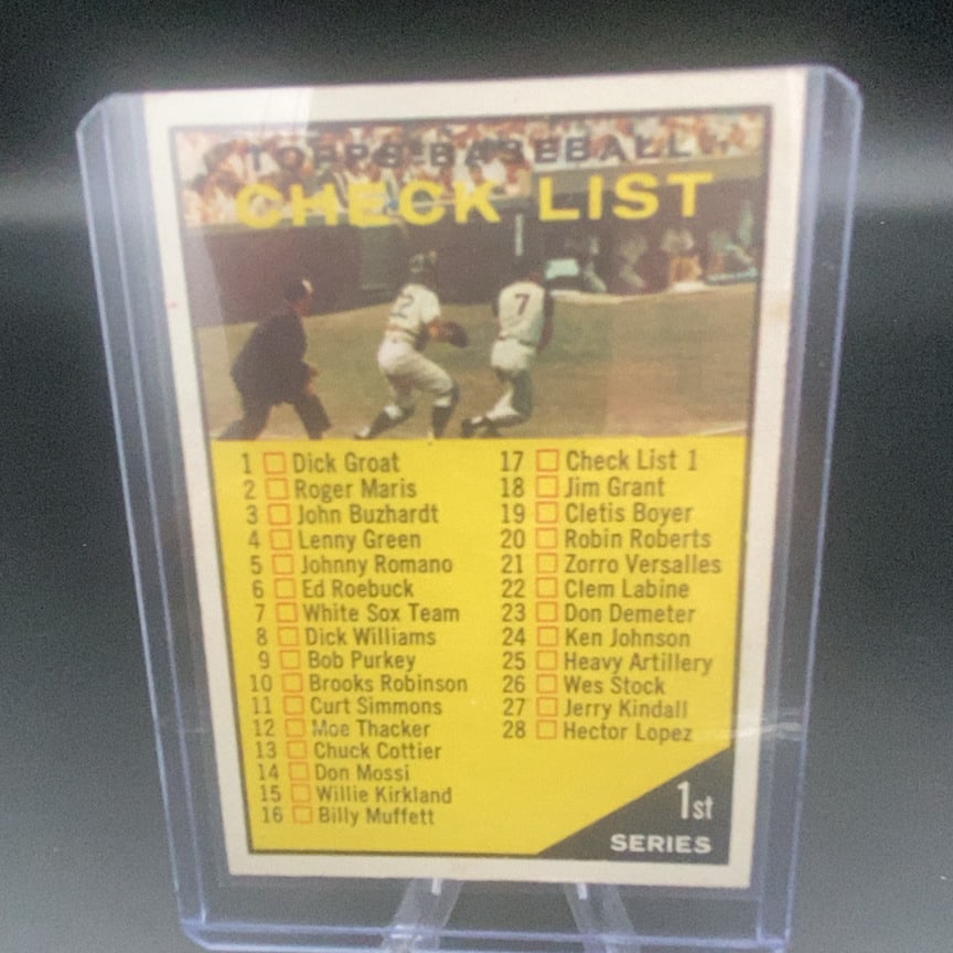 1961 Topps #17 First Series Baseball Checklist card: This is a 1961 Topps Baseball Checklist card. It features a list of players numbered 1 through 28, representing the 1st Series of the set. The card design includes an action shot of a baseball game