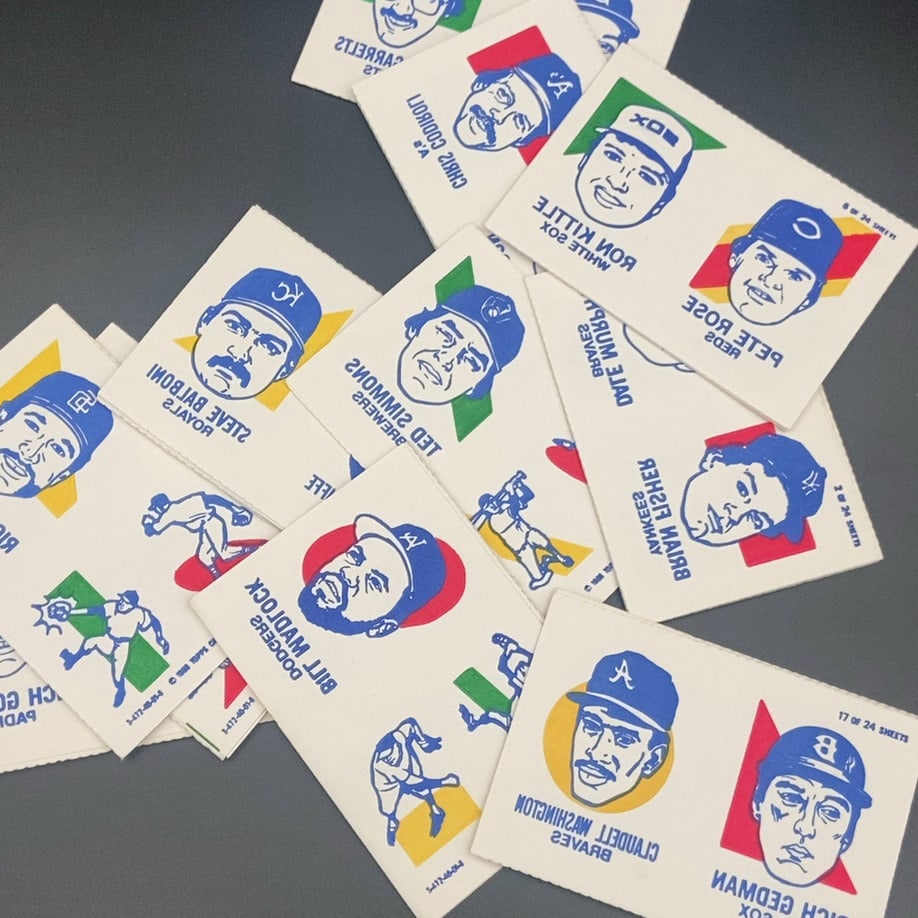 1983 Topps Baseball Stickers: This is a sheet of 1983 Topps baseball player stickers featuring various Major League Baseball players. The sheet includes headshots and action poses for players such as Reggie Jackson, Pete Rose,
