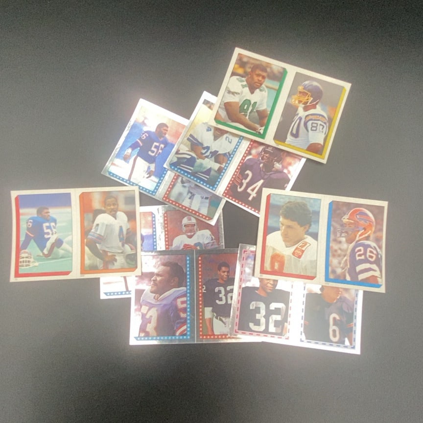1990 Pro Set Football Card Lot: This is a collection of 1990 Pro Set football cards, featuring various NFL players including those wearing numbers 56, 34, 32, and 26. These trading cards display distinctive colored borders and