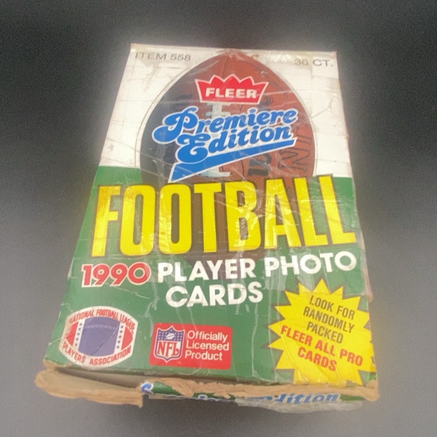 1990 Fleer Premiere Edition Football Box: This is a 1990 Fleer Premiere Edition Football trading card display box containing 36 counts of player photo cards. The packaging features the Fleer brand logo and branding for the National Football