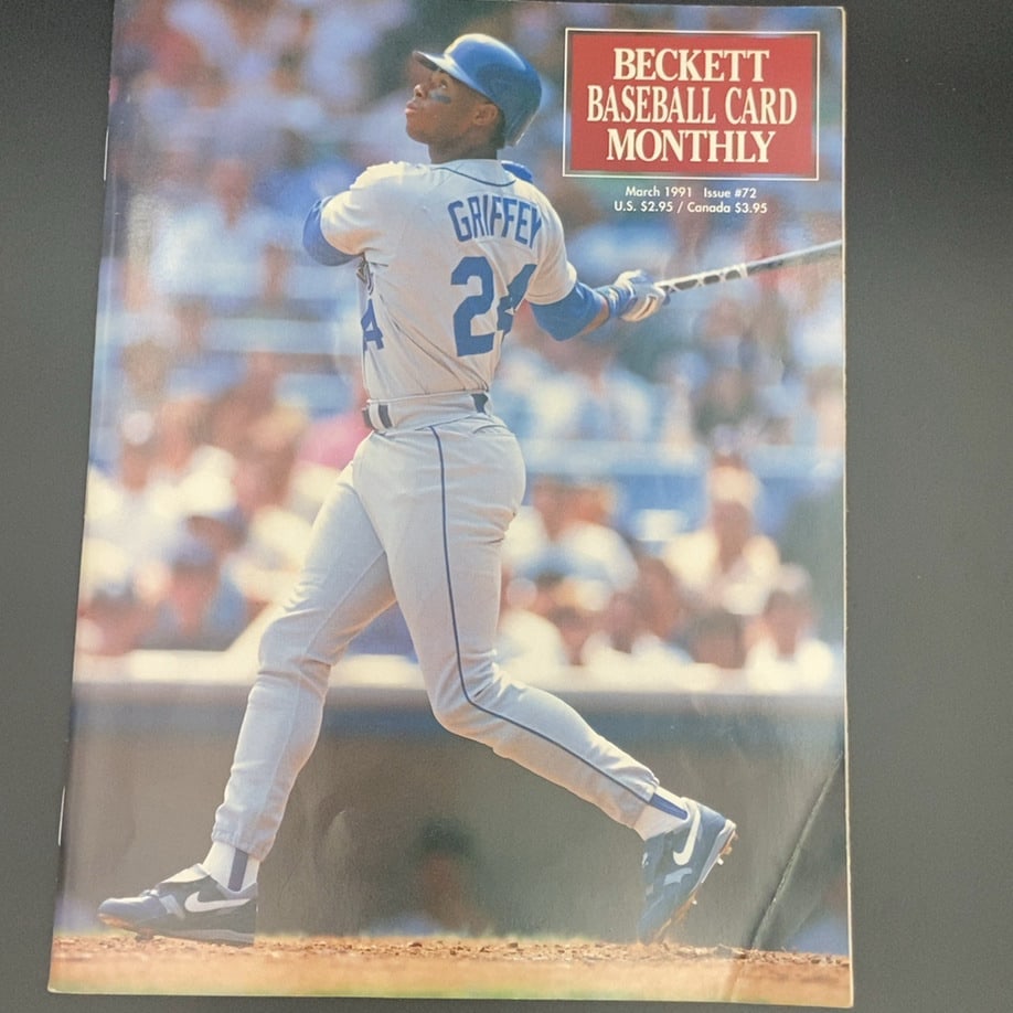1991 Beckett Baseball Card Monthly Issue #72: This is the March 1991 issue #72 of Beckett Baseball Card Monthly magazine. The cover features a photograph of baseball player Ken Griffey Jr. in his uniform swinging a bat.