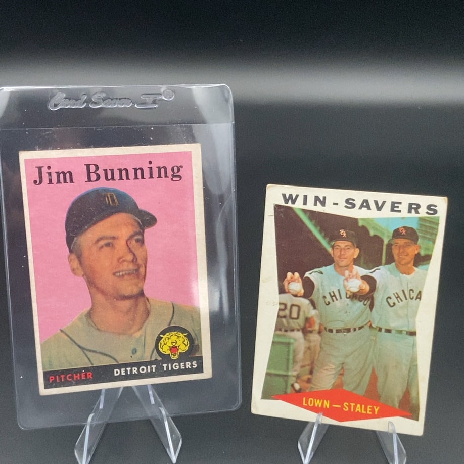 1958 Topps #115 Jim Bunning baseball card alongside a 1959 Topps "Win-Savers" card: This lot features two vintage 1958 & 1959 Topps baseball cards. It includes a Jim Bunning Detroit Tigers card and a Win-Savers card featuring Bill Lown and Gerry Staley of the Chicago White Sox.