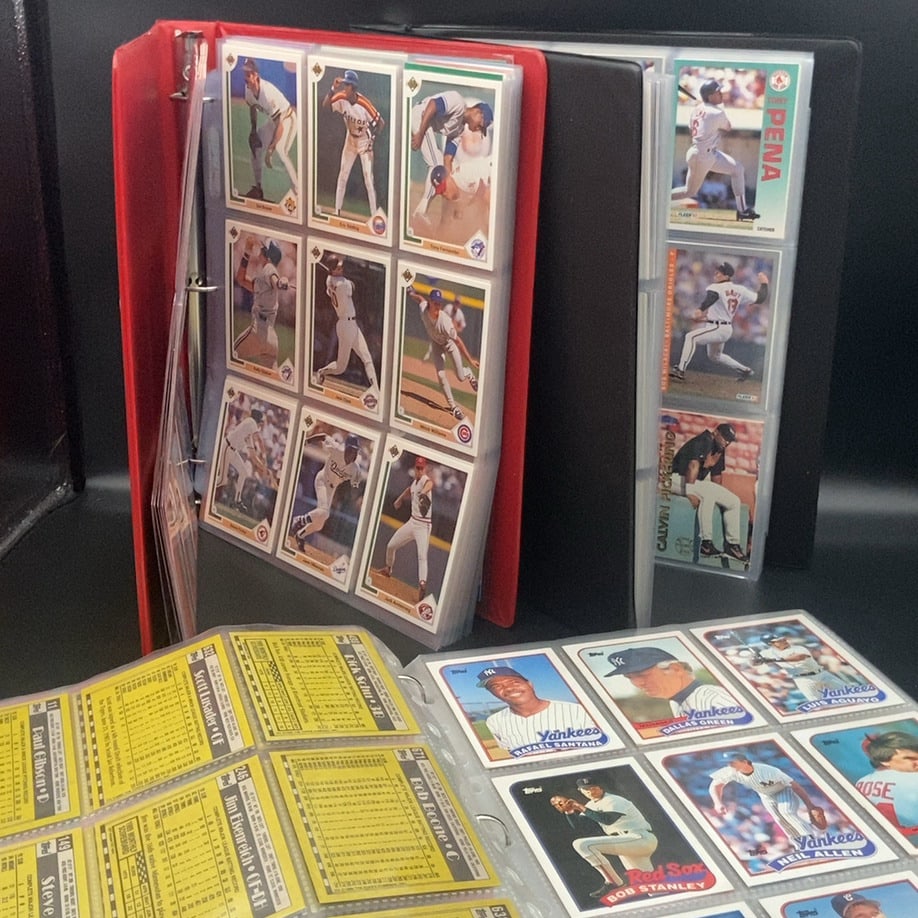 Vintage Major League Baseball trading cards from the late 1980s and early 1990s: This is a collection of vintage baseball cards stored in 3 binders. The set includes various players from popular 1980s sets such as Upper Deck and Topps, featuring both front action shots and rear