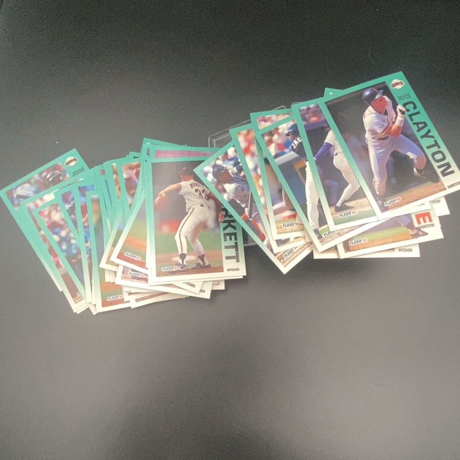 1992 Fleer Baseball Cards: A collection of 1992 Fleer baseball cards featuring various players including Royce Clayton. The cards are characterized by their distinct teal borders and Fleer 92 logo. These are standard sports