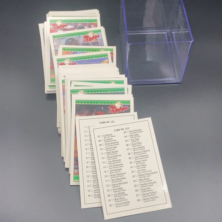 1992 Donruss The Rookies Baseball Card Set: This is a stack of 1992 Donruss The Rookies baseball cards, including a checklist card labeled Card No. 132. The set comes with a clear plastic protective storage case for the cards. These cards are