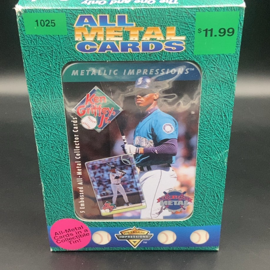 1996 Metallic Impressions Ken Griffey Jr. 5 Embossed All-Metal Collector Cards set: This is a sealed vintage retail box containing a collectible tin of 1996 Metallic Impressions Major League Metal trading cards featuring Ken Griffey Jr. The set highlights the Seattle Mariners star wi
