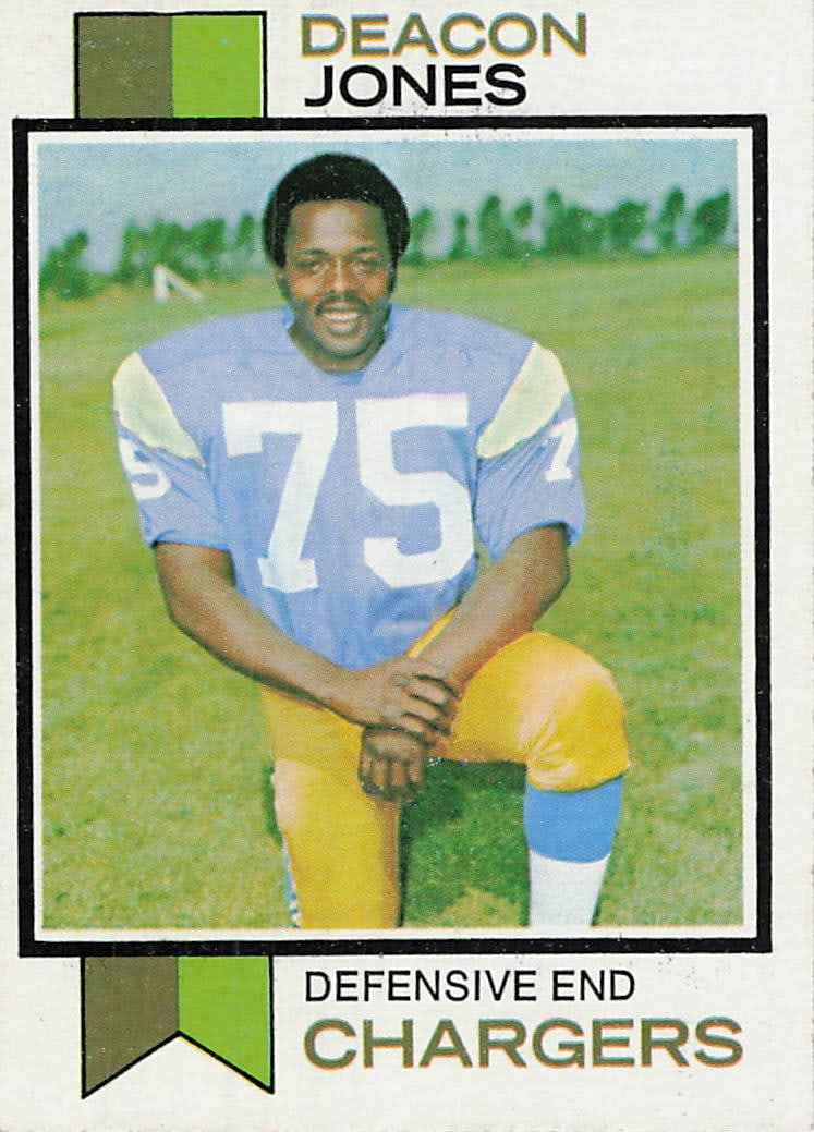 1973 Topps Football Card #38 featuring Hall of Fame defensive end Deacon Jones: 1973 Topps Football Deacon Jones / Mike Garrett #38 is a base trading card featuring Deacon Jones during his tenure with the Chargers. This vintage Topps issue pairs a Deacon Jones player image with