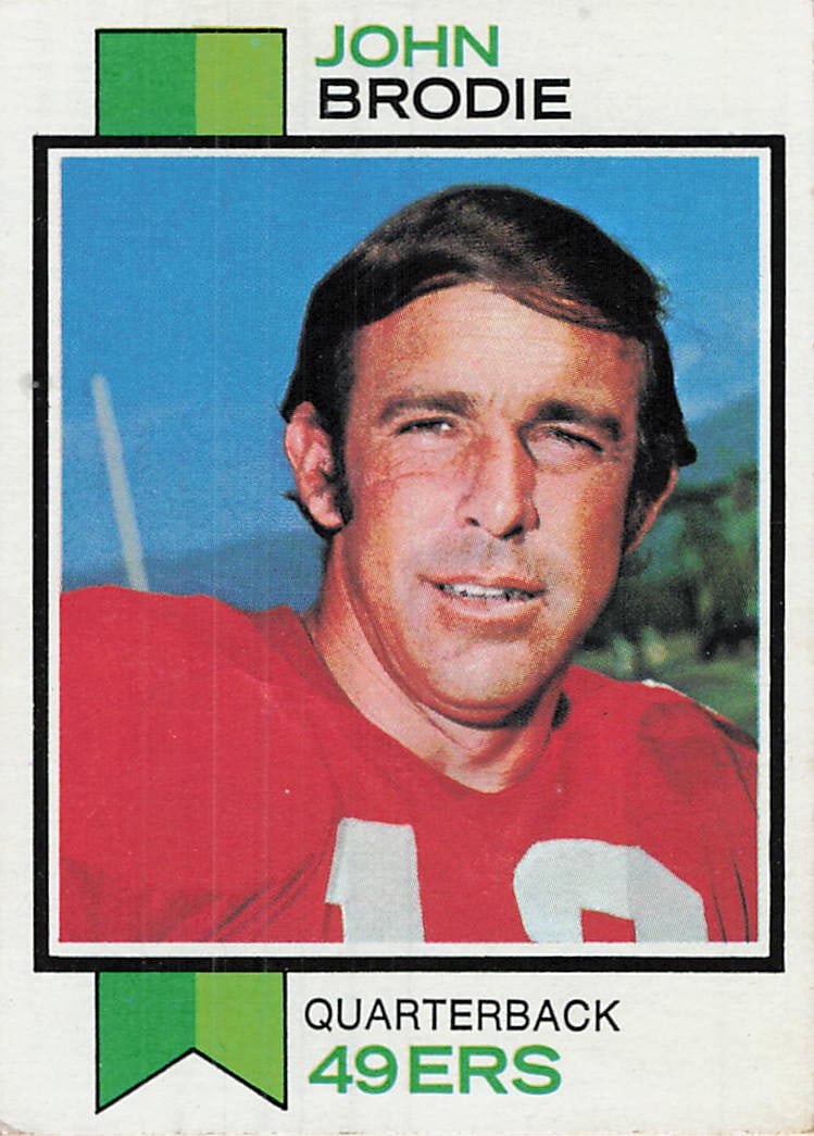 1973 Topps John Brodie #45 football trading card: This is a 1973 Topps football card featuring John Brodie, the longtime quarterback for the San Francisco 49ers. The card features Brodie in his 49ers uniform with the classic 1973 Topps design.