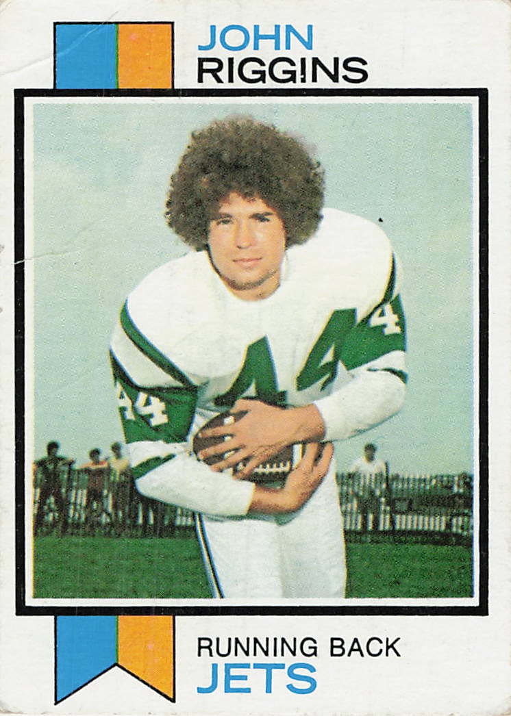1973 Topps John Riggins New York Jets #245 football trading card: 1973 Topps Football John Riggins #245 is a base trading card featuring John Riggins during his tenure with the New York Jets. This vintage early-1970s Topps football issue highlights Riggins in his