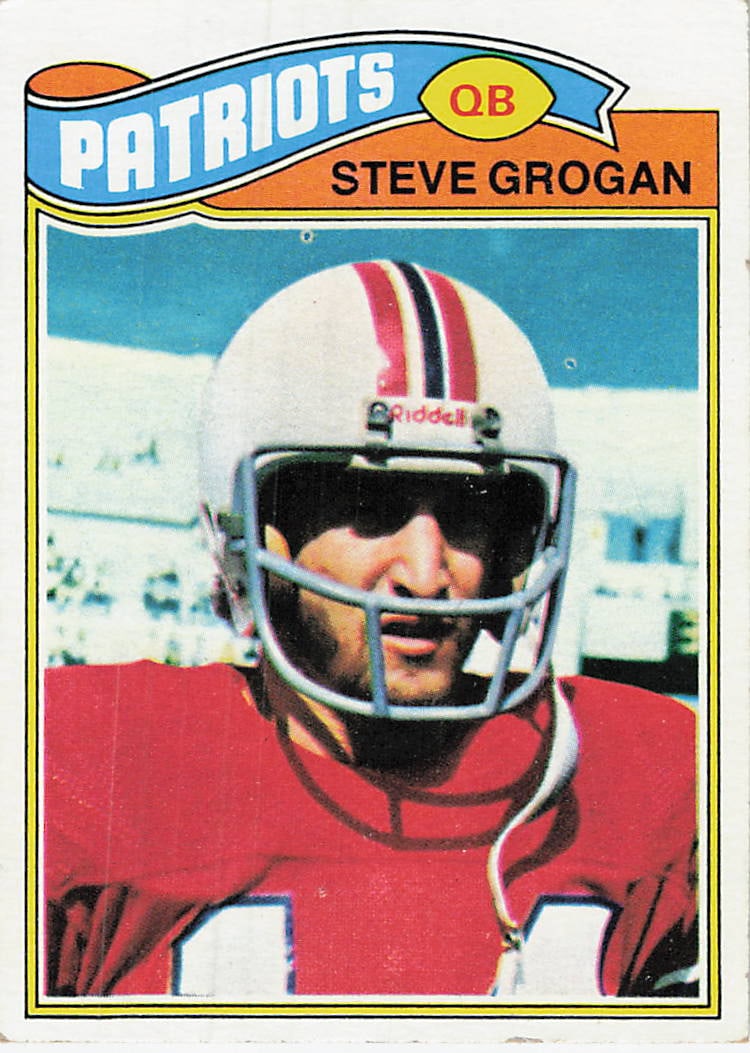 1977 Topps Steve Grogan #165: 1977 Topps Football Steve Grogan #165 is a base trading card featuring Steve Grogan during his tenure with the New England Patriots. Issued during Grogan's early Patriots run, this vintage Topps