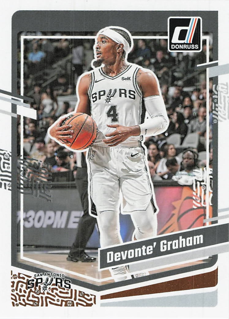 2023-24 Panini Donruss Devonte' Graham #59 basketball trading card: 2023 Panini Donruss Basketball Devonte' Graham #59 is a base trading card featuring Devonte' Graham during his tenure with the San Antonio Spurs. Issued in Panini's Donruss Basketball release, this