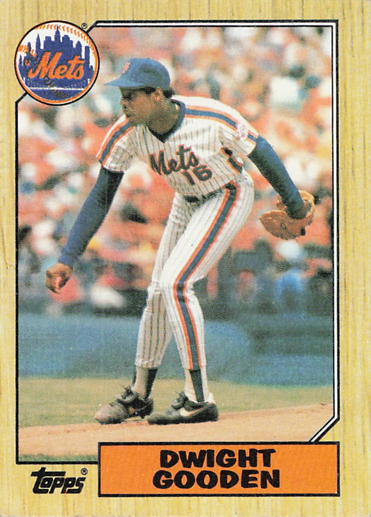 1987 Topps Dwight Gooden #130 baseball trading card: This is a 1987 Topps baseball trading card featuring Dwight Gooden of the New York Mets. The card highlights Gooden during his standout MLB career and features the classic 1987 Topps wood-grain