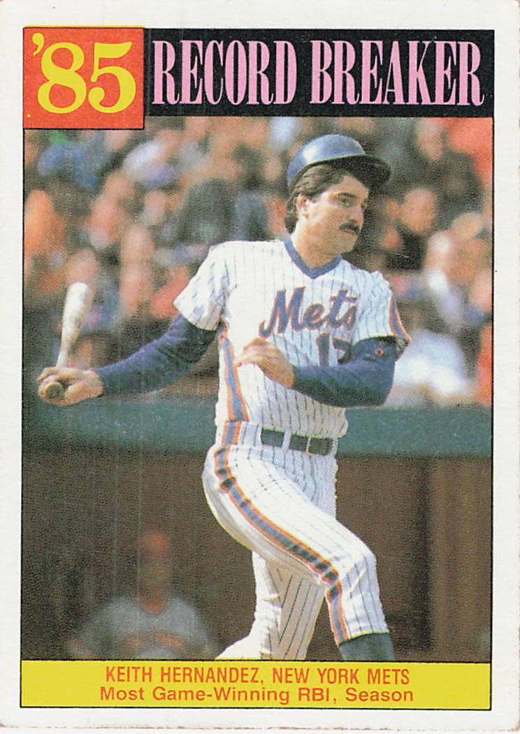 1986 Topps #203 Keith Hernandez Record Breaker baseball trading card: This is a 1986 Topps Record Breaker baseball trading card featuring Keith Hernandez of the New York Mets. The card celebrates Hernandez’s notable achievement and features the classic 1986 Topps