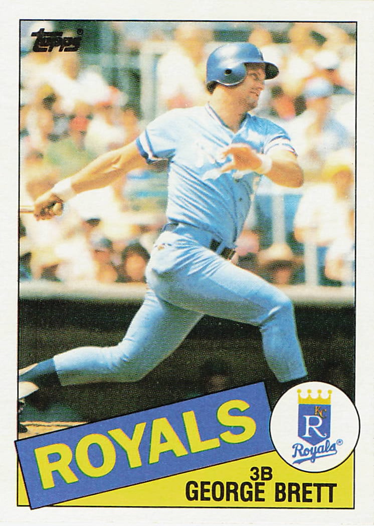 1985 Topps #100 George Brett baseball trading card: This is a 1985 Topps baseball trading card featuring George Brett of the Kansas City Royals. The card highlights Brett during his celebrated MLB career and features the classic 1985 Topps design from