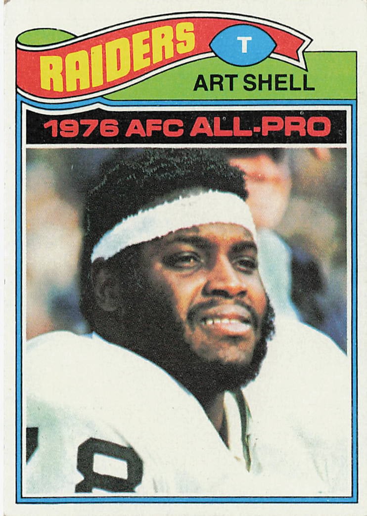 1977 Topps football trading card for Hall of Fame offensive tackle Art Shell of the Oakland Raiders: This is a 1977 Topps football trading card featuring Hall of Fame offensive tackle Art Shell of the Oakland Raiders. The card highlights Shell during his standout NFL career and features the classic