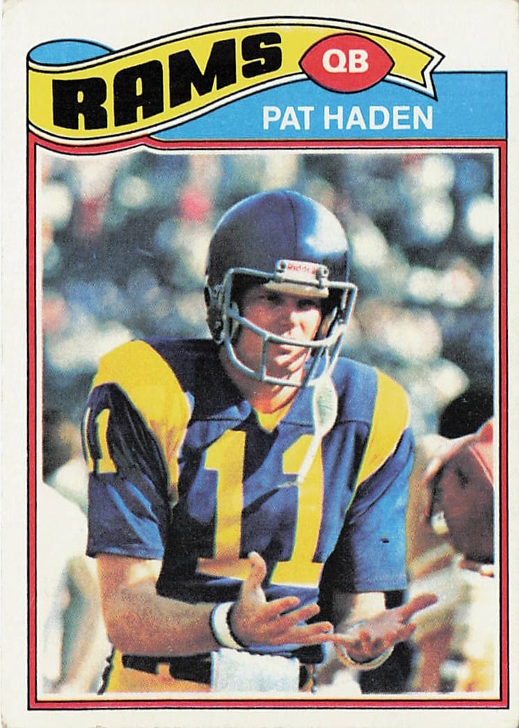 1977 Topps Pat Haden #18 Rookie Card featuring the Los Angeles Rams quarterback: This is a 1977 Topps rookie football card featuring Pat Haden of the Los Angeles Rams. The card highlights Haden early in his NFL career and features the classic 1977 Topps design from the 1970s