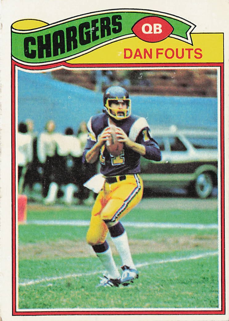 1977 Topps Dan Fouts #274 football trading card: This is a 1977 Topps football trading card featuring Dan Fouts of the San Diego Chargers. The card highlights Fouts during his early NFL career and features the classic 1977 Topps design from the