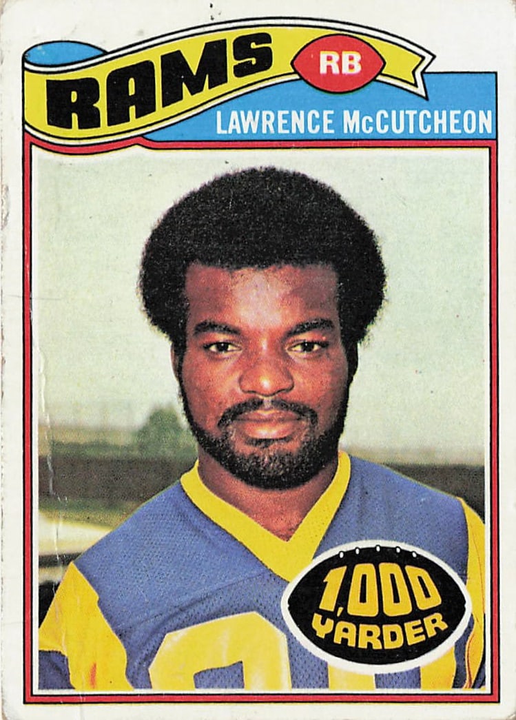 1977 Topps football card featuring running back Lawrence McCutcheon: This is a 1977 Topps football card featuring running back Lawrence McCutcheon of the Los Angeles Rams. The card highlights McCutcheon during his successful NFL career and features the classic 1977