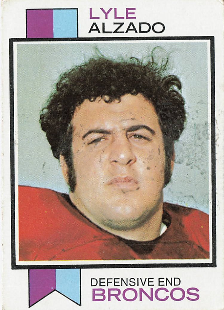1973 Topps Lyle Alzado #312: This is a 1973 Topps football card featuring Lyle Alzado, the standout defensive lineman known for his time with the Denver Broncos. The card highlights Alzado during his early NFL career and