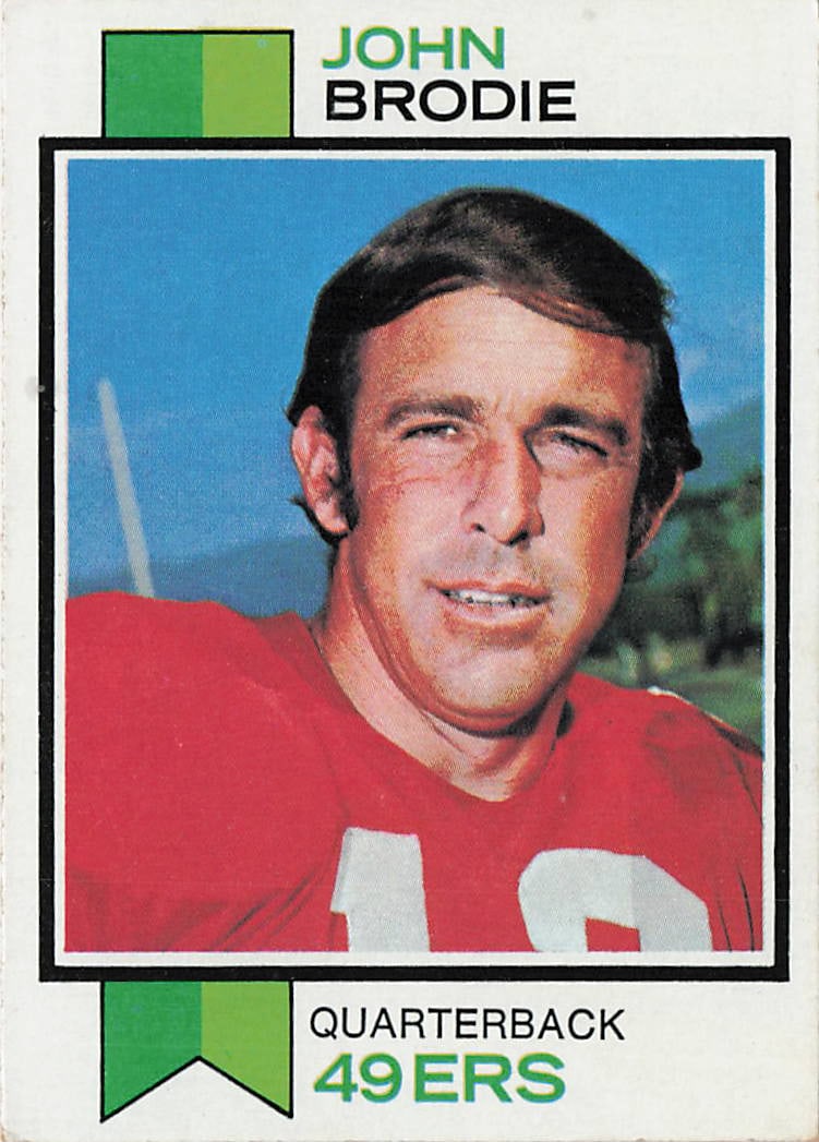 1974 Topps John Brodie San Francisco 49ers #45: This is a 1974 Topps football card featuring John Brodie of the San Francisco 49ers. The card highlights Brodie during his long NFL career as a standout quarterback and features the classic 1974