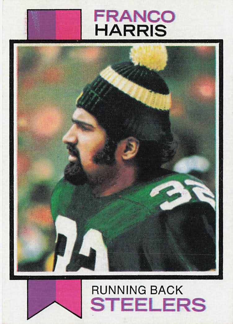 1973 Topps #89 Franco Harris Rookie Card: This is a 1973 Topps rookie football card featuring Franco Harris of the Pittsburgh Steelers. The card highlights Harris early in his legendary NFL career and features the classic 1973 Topps design