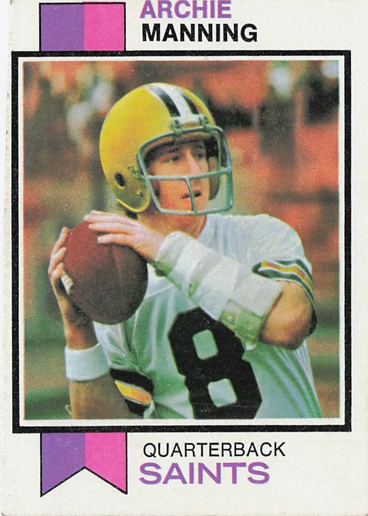 1973 Topps #125 Archie Manning football card: This is a 1973 Topps football card featuring Archie Manning of the New Orleans Saints. The card highlights Manning during his NFL career as a standout quarterback and features the classic 1973 Topps