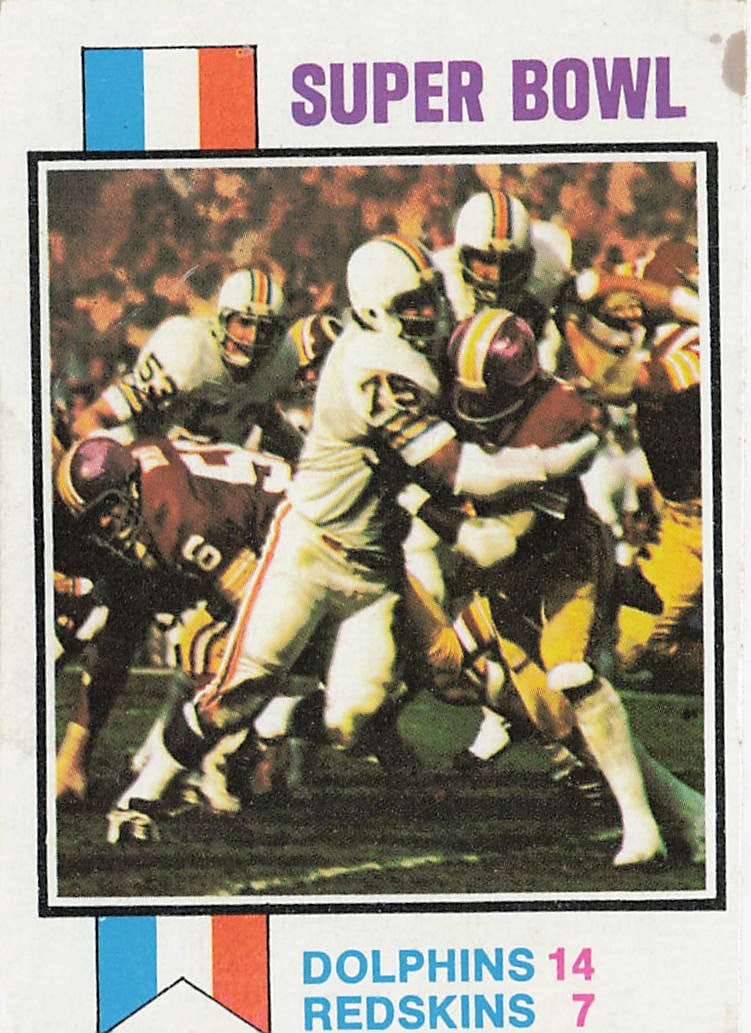 1973 Topps #139 Super Bowl VII football card: This is a 1973 Topps football trading card featuring Super Bowl VII, the championship game of the 1972 NFL season. The card commemorates the historic matchup and features the classic 1973 Topps design