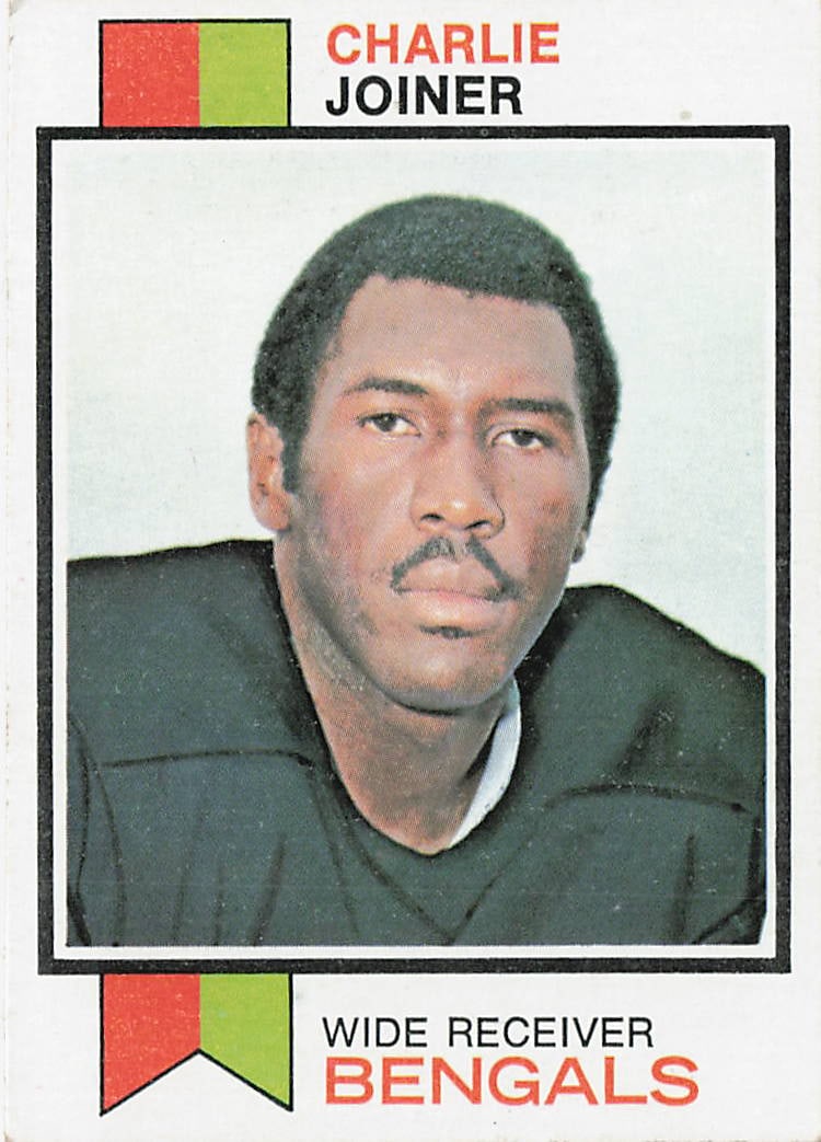 1973 Charlie Joiner Topps #467 Cincinnati Bengals: This is a 1973 Topps football trading card featuring Charlie Joiner of the Cincinnati Bengals. The card highlights Joiner during his NFL career as a talented wide receiver and features the classic 197