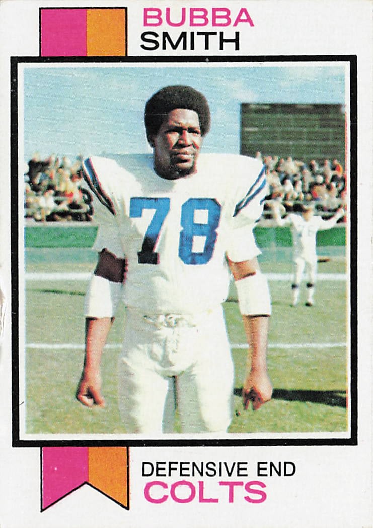 1973 Topps Bubba Smith #155 football trading card: This is a 1973 Topps football trading card featuring Bubba Smith, the standout defensive lineman of the Baltimore Colts. The card highlights Smith during his NFL career and features the classic 1973 T