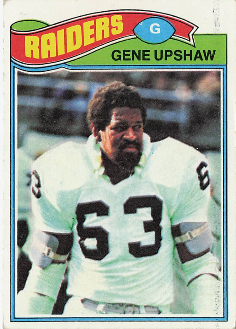 1977 Topps Gene Upshaw #415 football card: This is a 1977 Topps football card featuring Gene Upshaw of the Oakland Raiders. The card highlights the Hall of Fame offensive lineman during his NFL career and features the classic 1977 Topps