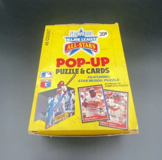 Donruss Major League All-Stars Pop-Up Puzzle & Cards: 48-count box of 1980s Donruss Major League All-Stars Pop-Up Puzzle & Cards. The box features artwork of players like Jack Clark and Kirby Puckett and highlights a Stan Musial puzzle.