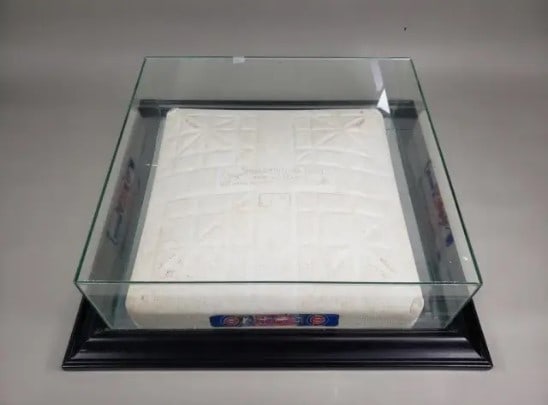 Chicago Cubs Hollywood Base: This is an authentic Hollywood Base featuring the Chicago Cubs logo on the side. The base is preserved in a custom glass display case with a black frame. It is an official piece of baseball memorabili