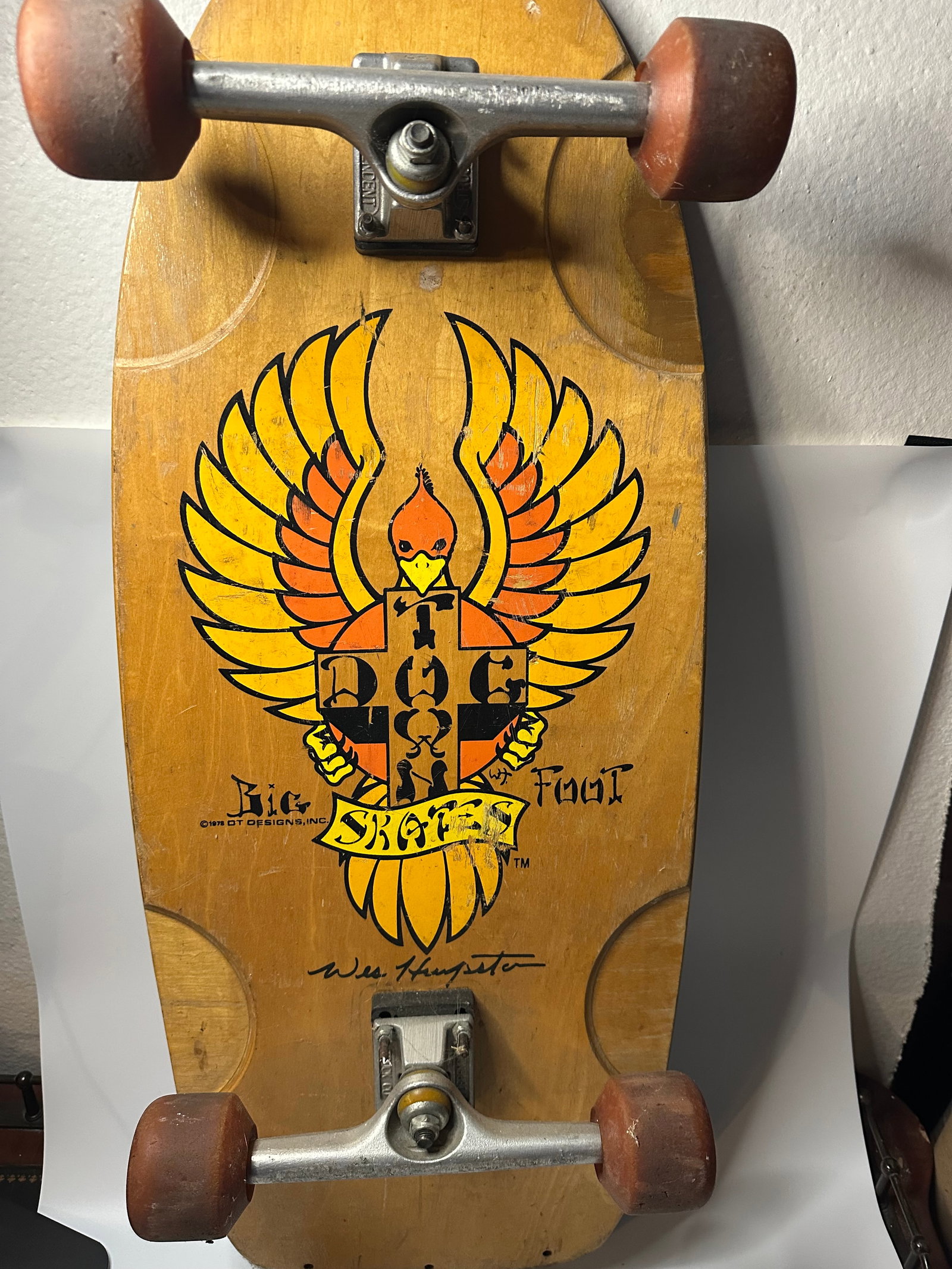 1978 Dogtown Skateboards Wes Humpston Bigfoot: This is a vintage 1978 Dogtown skateboard deck featuring the iconic Bigfoot graphic designed by Wes Humpston. The board includes original Independent trucks and wheels, displaying significant wear