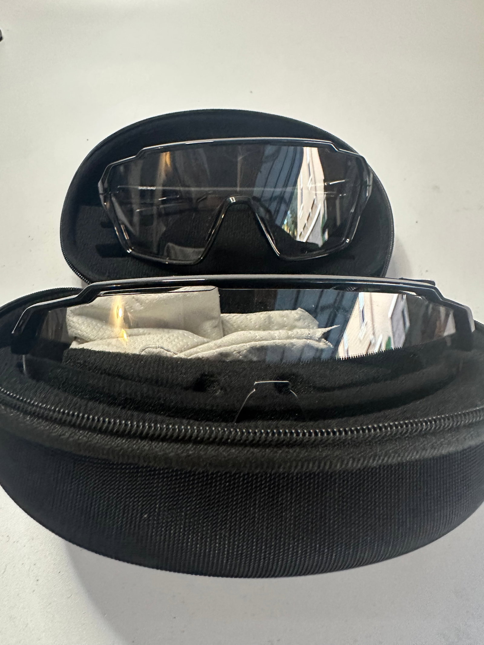 SMITH Glasses with Hard Case: A pair of Smith branded sports glasses featuring a sleek, wraparound design. The item is accompanied by its original black zippered protective hard case.