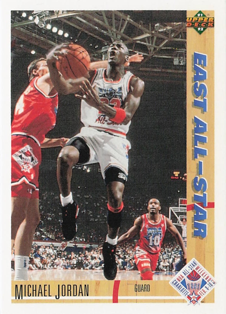 1991-92 Upper Deck Michael Jordan #69 basketball card: This special subset card commemorates the Chicago Bulls icon's performance at the 1991 NBA All-Star Weekend in Charlotte, North Carolina. The card front shows an aggressive, mid-air action shot of Mic