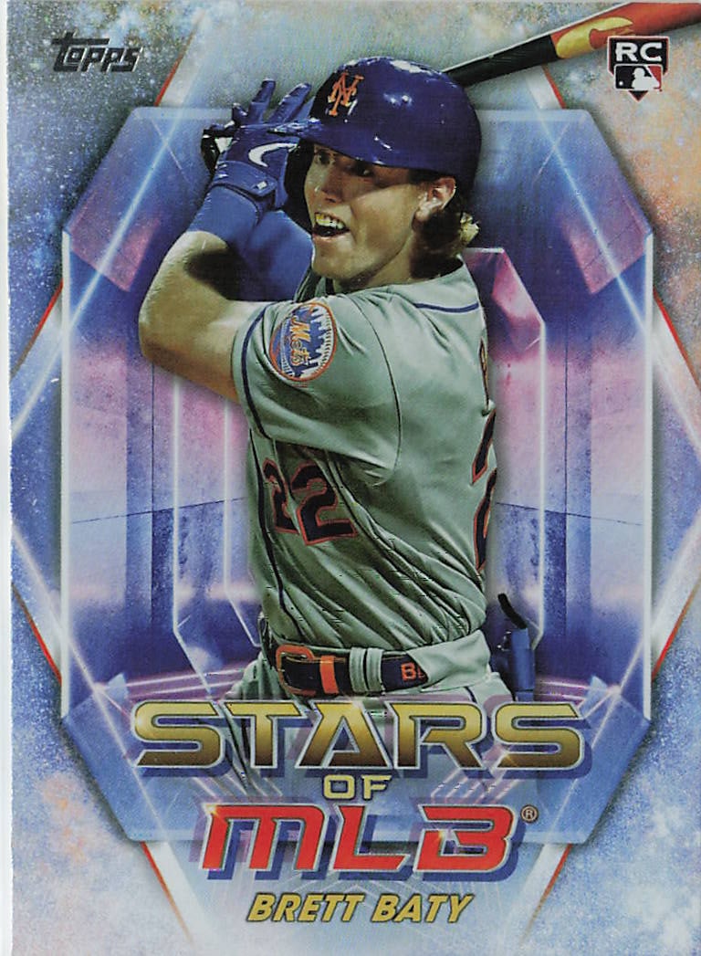 2023 Topps Update Series Stars of MLB rookie insert card (#SMLB-77): This insert captures third baseman Brett Baty in a dynamic batting stance wearing his gray road uniform for the New York Mets. It belongs to the Stars of MLB retail insert series featured in the 2023