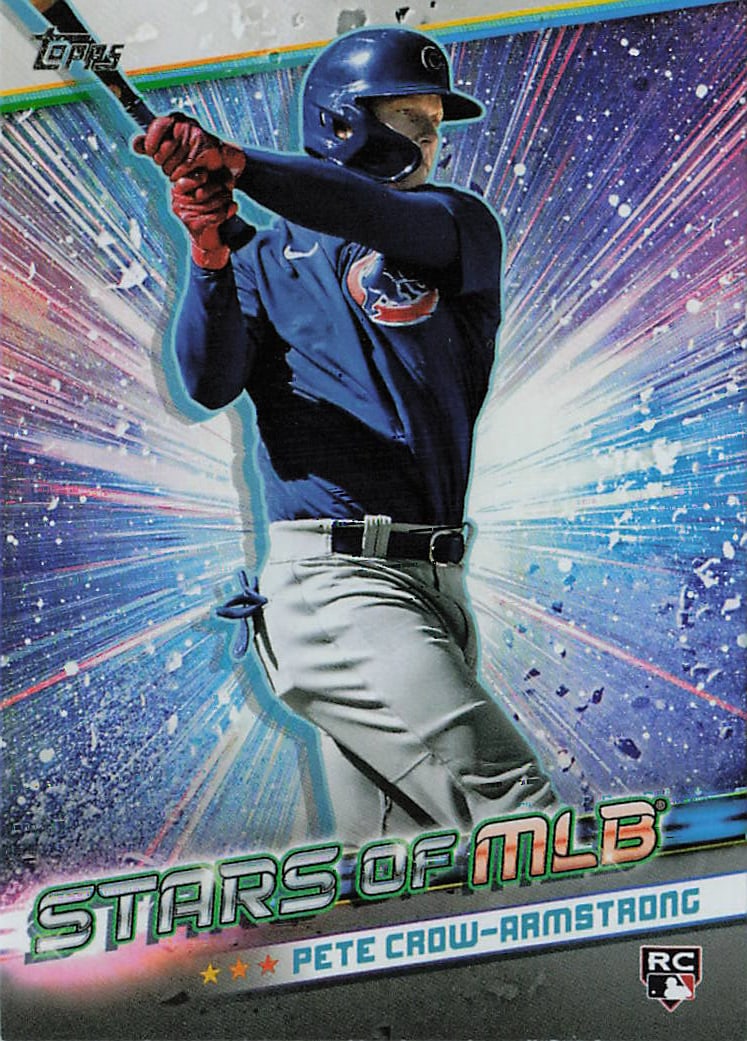 2024 Topps Series 1 Stars of MLB Pete Crow-Armstrong #SMLB-25 rookie insert card: This retail-exclusive insert card features electric outfielder Pete Crow-Armstrong locked into a powerful swing in his alternate dark blue jersey for the Chicago Cubs. Embracing the cosmic layout desi