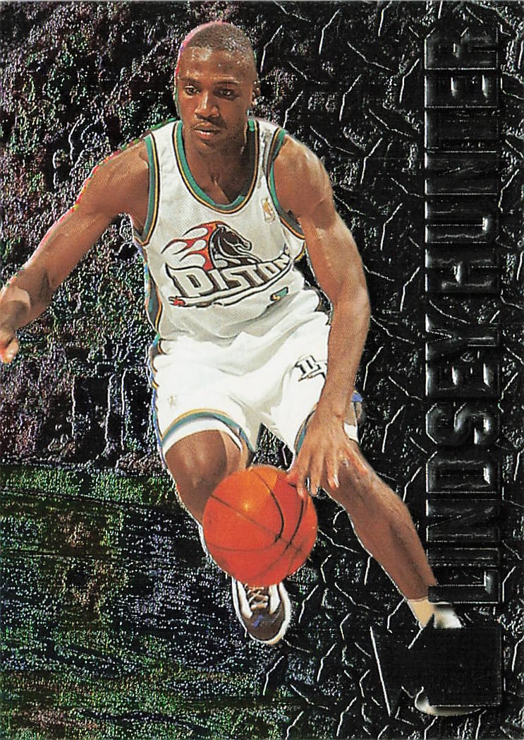 1996-97 Fleer Metal Lindsey Hunter #169 basketball trading card: This card comes from the highly popular, retro-styled 1996-97 Fleer Metal base set line. It captures defensive-minded point guard and future two-time NBA champion Lindsey Hunter handling the ball in