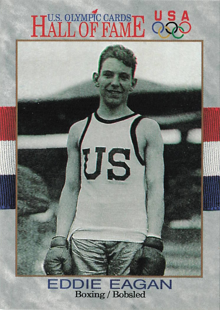 1991 Impel U.S. Olympic Hall of Fame Eddie Eagan #17 trading card: The 1991 Impel U.S. Olympic Hall of Fame Eddie Eagan #17 trading card features a gray stone-textured border framing a vintage black-and-white photograph of the legendary athlete smiling in his "US"