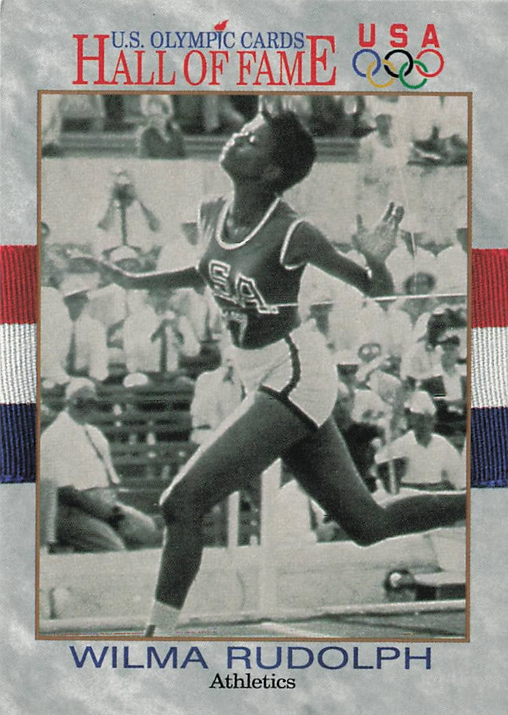 1991 Impel U.S. Olympic Hall of Fame Wilma Rudolph #7 trading card: The 1991 Impel U.S. Olympic Hall of Fame Wilma Rudolph #7 trading card features a gray stone-textured border framing a historic black-and-white action photograph of the legendary sprinter competing