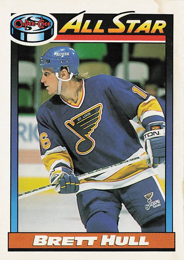 1991-92 O-Pee-Chee Brett Hull All-Star #259 trading card: The 1991-92 O-Pee-Chee Brett Hull All-Star #259 trading card features a light-blue border framing a portrait action photograph of the legendary St. Louis Blues right winger skating down the ice in