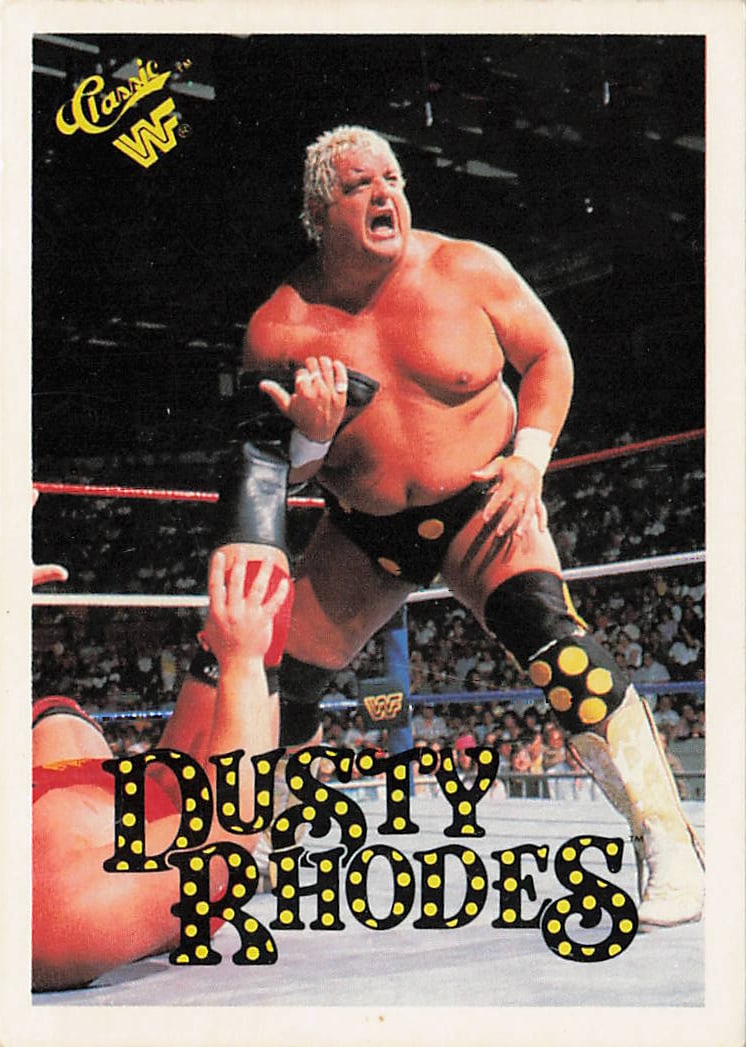 1990 Classic WWF Dusty Rhodes #71 trading card: The 1990 Classic WWF Dusty Rhodes #71 trading card features a thin white outer border framing an energetic, in-ring action photograph of the WWE Hall of Famer Dusty Rhodes locking an opponent in a sub