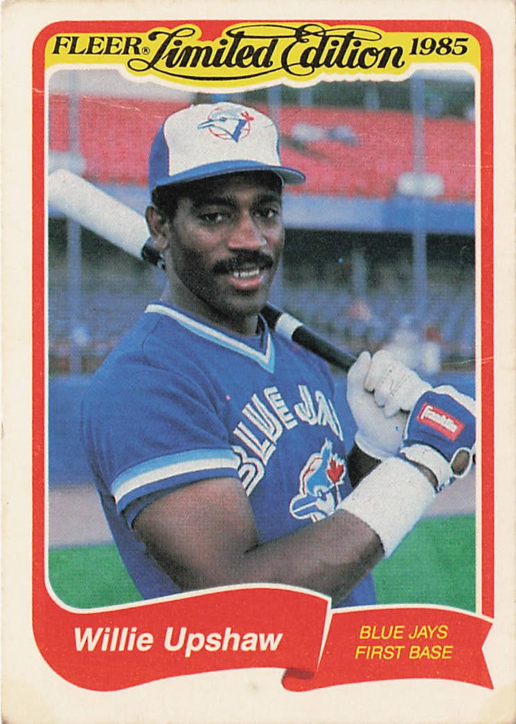 1985 Fleer Limited Edition Willie Upshaw #41: The 1985 Fleer Limited Edition Willie Upshaw #41 is a vintage baseball card manufactured by Fleer Corporation that presents a smiling studio portrait of the Toronto Blue Jays first baseman holding a