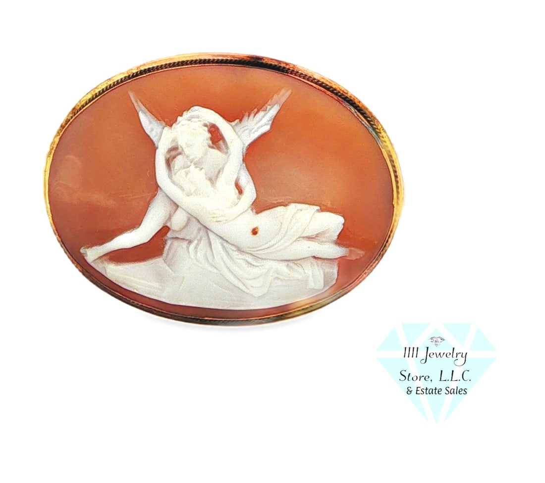 Vintage 18K 750 Yellow Gold Cameo Brooch/Pendant Man & Angel: Title: Vintage 18K 750 Yellow Gold Cameo Brooch/Pendant Man & Angel Description: This Intricately carved classic oval cameo brooch features a detailed white relief of winged figures embracing against 