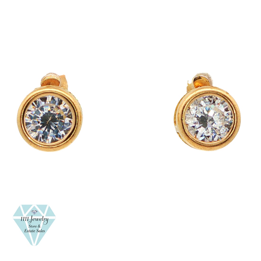 Signed L 14K Yellow Gold 2 CTW Cubic Zirconia Bezel Stud Earrings: Title: Signed L 14K Yellow Gold 2 CTW Cubic Zirconia Bezel Stud Earrings Description: Pair of designer-signed stud earrings in 14K yellow gold, each set with one round faceted clear cubic zirconia in 