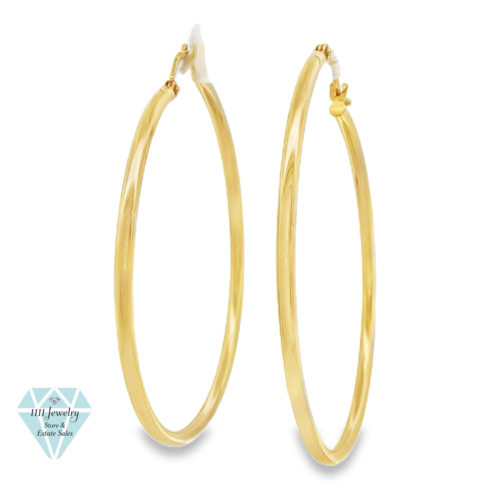 14K Yellow Gold 1.5-Inch Large Hoop Earrings: Title: Blue Nile 14K Yellow Gold 1.5-Inch Large Hoop Earrings; Retails: $980 Description: Pair of large hoop earrings crafted in 14K yellow gold with slender polished tubular construction and hinged l