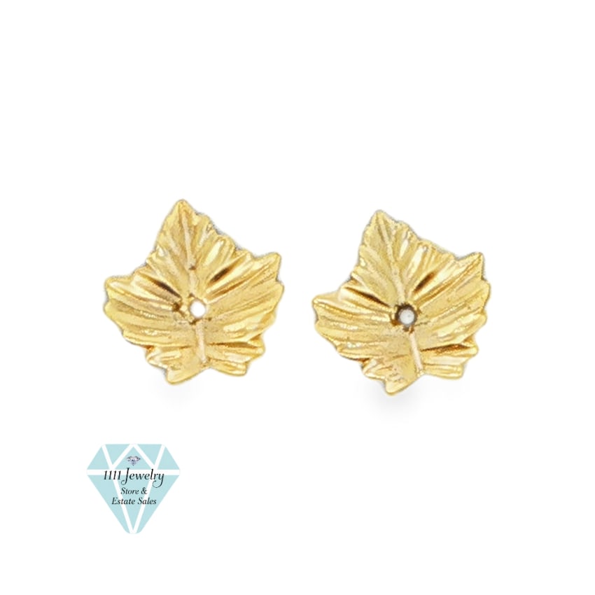 Pair of 14K Yellow Gold Leaf Earring Enhancers: Title: Pair of 14K Yellow Gold Leaf Earring Enhancers Description: Pair of unbranded leaf-shaped earring enhancers crafted in 14K yellow gold. Each enhancer has a textured stylized-leaf design and a c