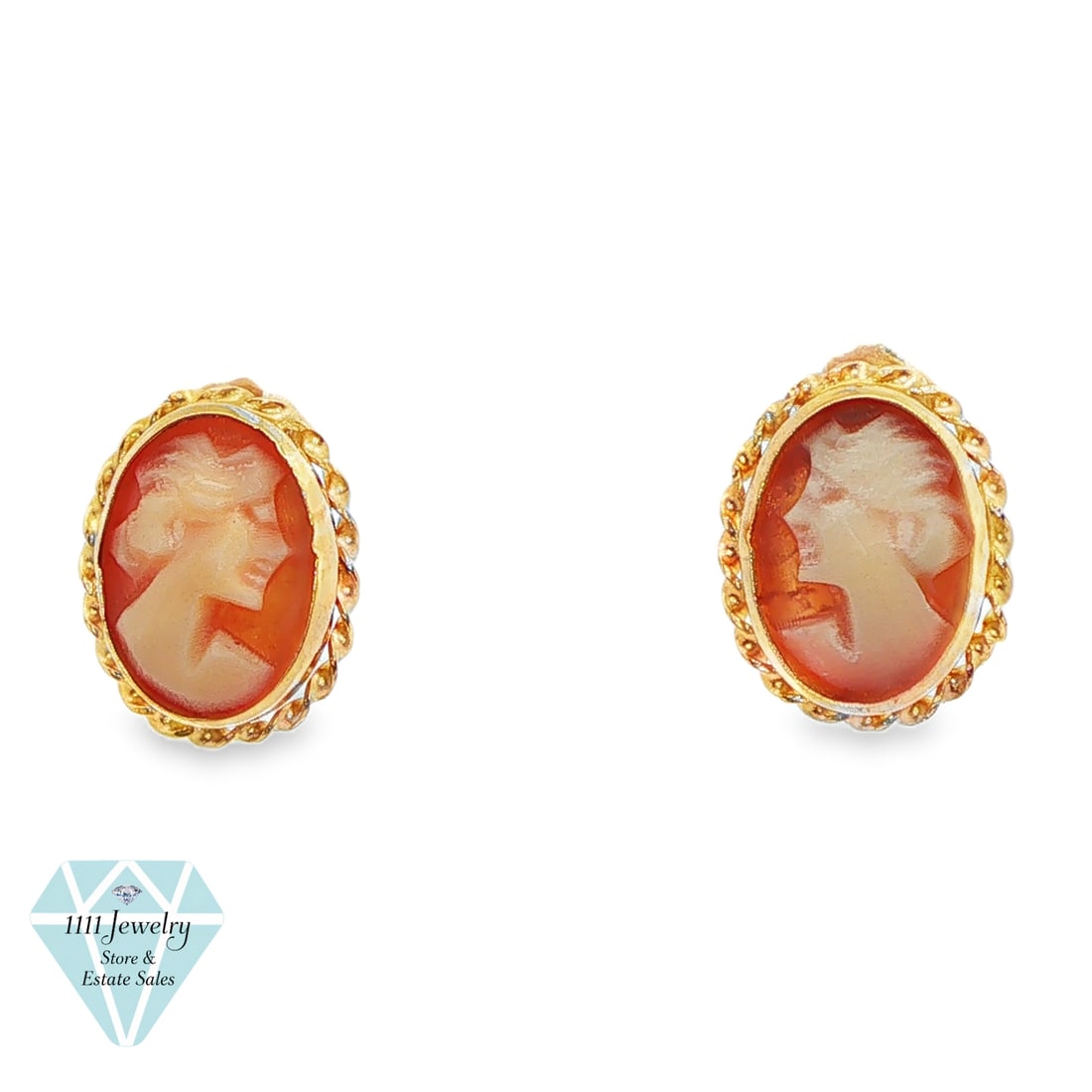 Vintage 14K Yellow Gold Carnelian Cameo Stud Earrings: Title: Vintage 14K Yellow Gold Carnelian Cameo Stud Earrings Description: Pair of vintage oval cameo stud earrings, each featuring a carved cream-colored female profile against an amber-orange carneli
